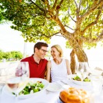 Lovely Mature Couple Enjoying Food in a Restaurant