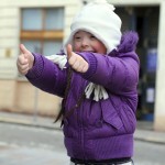 Portrait of beautiful happy girl giving thumbs up.