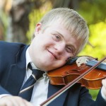 Portrait of young handicapped violinist.