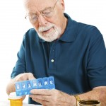 Senior Man Sorting Pills